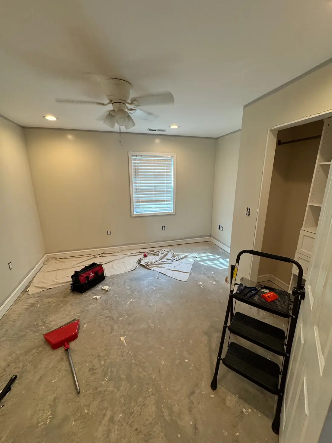 Bedroom during transition from the original color to a neutral wall color