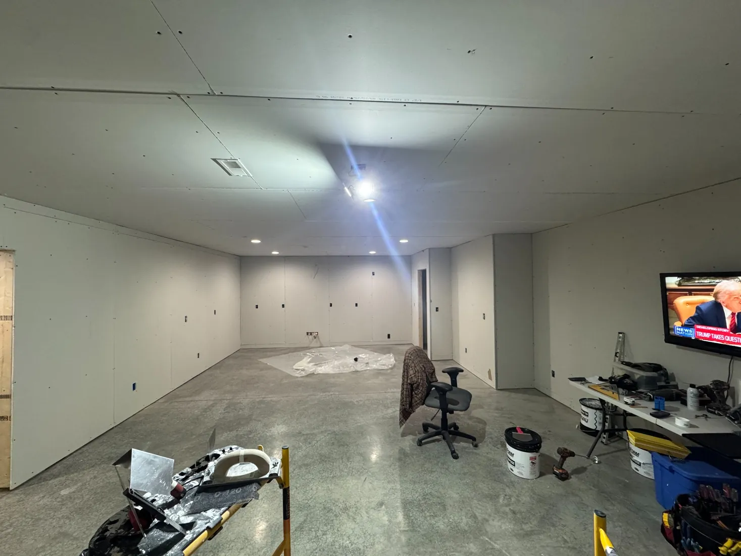 Commercial interior build-out by Frontline Home Solutions during drywall installation