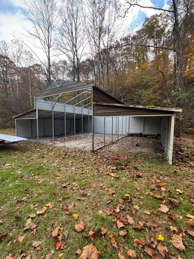 Existing open metal structure before the footer and steel-building build-out