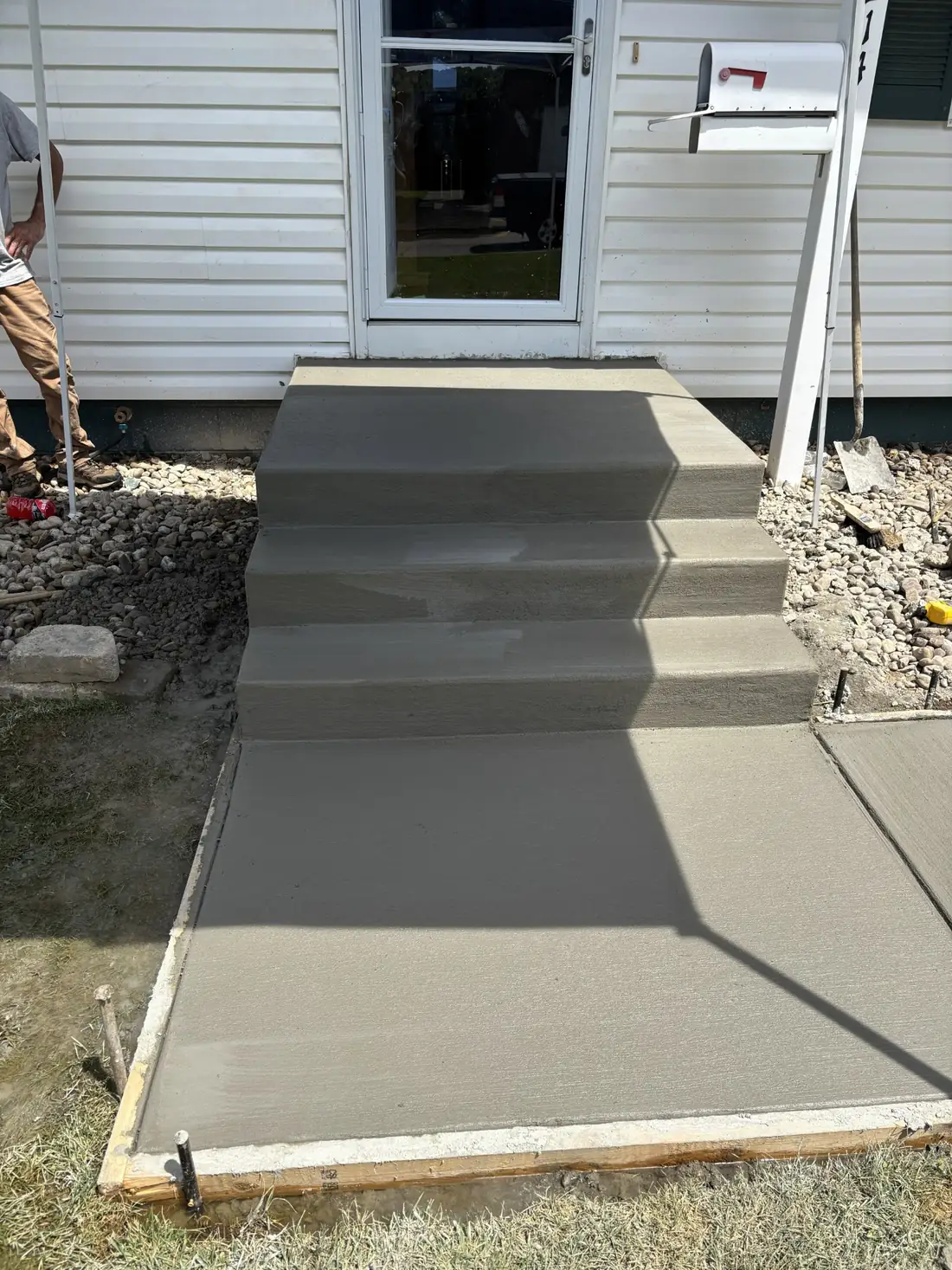 Freshly finished concrete steps and landing at the home entry
