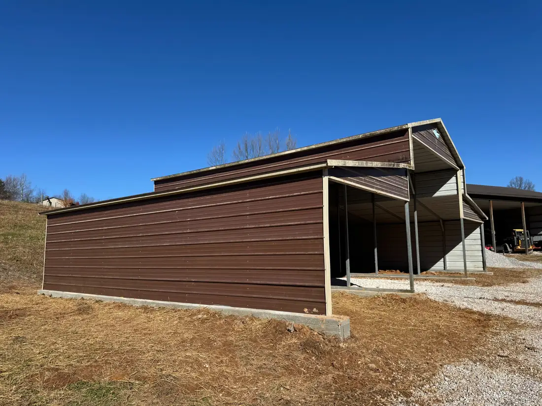 Steel building after concrete footing work and major exterior panel installation